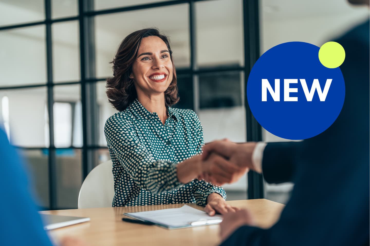 Woman smiling and shaking hand